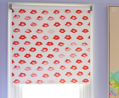 A blackout Roller Shade made of The Novogratz Painted Lips in Red Lips adds a pop-art feel to a girl's room