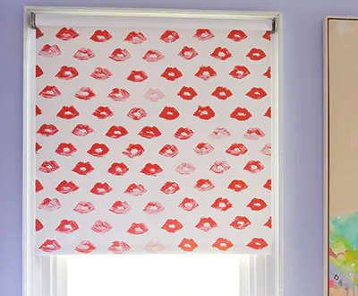 A blackout Roller Shade made of The Novogratz Painted Lips in Red Lips adds a pop-art feel to a girl's room