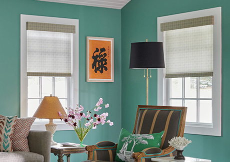 Pull down window shades in the Roller Shade style made of Houndstooth in Cargo cover windows in a turquoise sitting room
