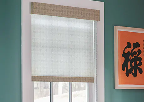Light filtering Roller Shade made of Houndstooth in Cargo allows soft light to filter into a bright turquoise room
