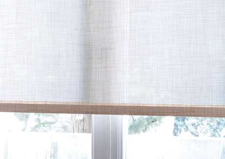 Roller shades come in light filtering material like Techno in Linen that filters light while offering bathroom window privacy