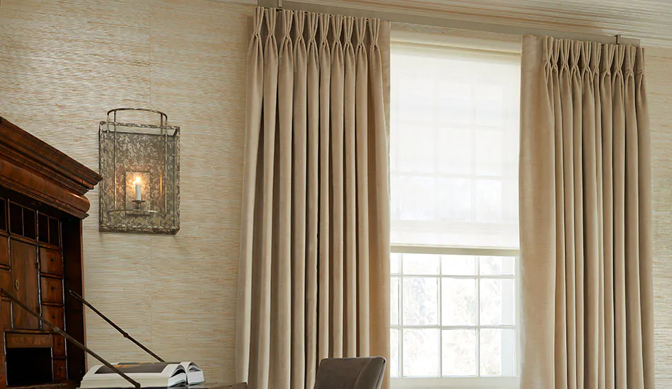 Basement window curtains made of Pinch Pleat Drapery of Velvet in Cream add elegance to a reading room