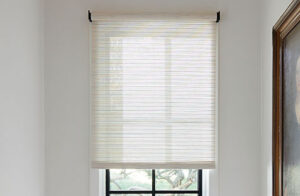 A close up of a Roller Woven Wood Shade made of Mesa Verde in Sand shows the light color and natural texture