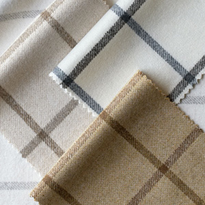 Roman Shade swatches made of Highland fabric are laid flat and feature a simple plaid pattern in neutral colors