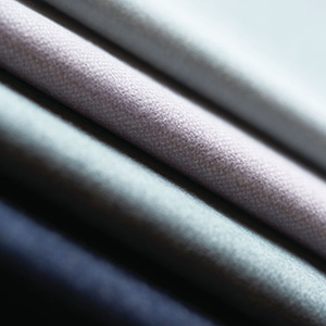 Roman Shade swatches made of Wool Flannel fabric are folded and stacked tightly and show the soft texture and inviting colors