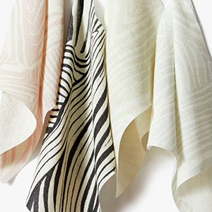 Swatches of The Novogratz Zebra Marble are folded invitingly together and show the playful, yet elegant marble pattern