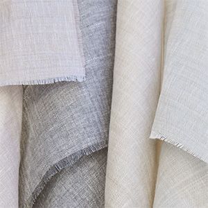 Sheer Wool Blend fabric swatches hang from a line and offer a light, airy look for linen Roman Shades