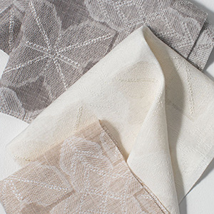 Swatches of Sheila Bridges' Origami in three colors are folded together and show the interesting shapes and textures