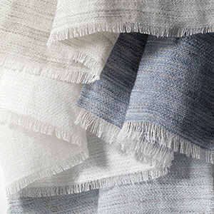 Swatches of Victoria Hagan's Breeze show the lightness of the fabric with a subtle heathered design for softness