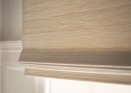 A close up of Woven Wood Shades made of Somerset in Cloud shows the texture and neutral color for nursery window treatments