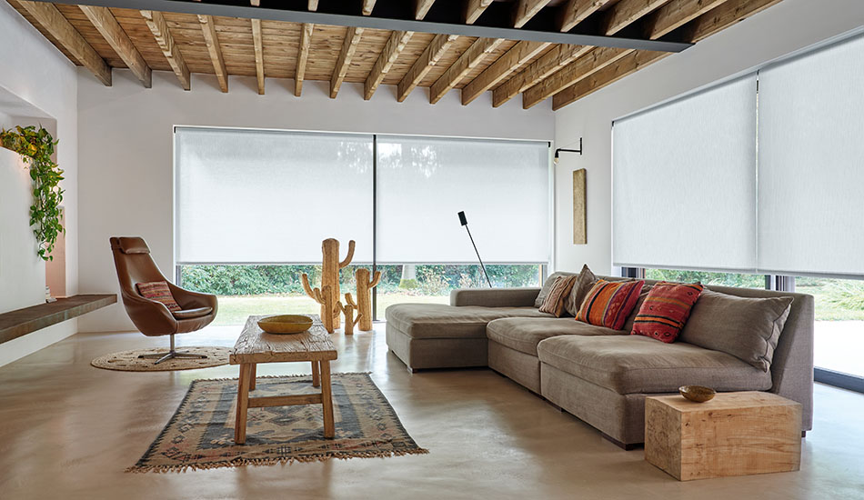Sun blocking shades made of 3% Thermo in Cloud soften the light in a modern southwestern-styled living room