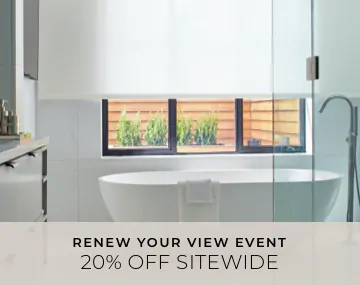 Solar Shades hang in a white bathroom with a freestanding tub with overlaid sales messaging for 20% off sitewide