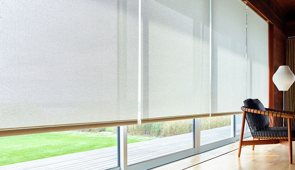 Types of blinds and shades include Solar Shades made of 10% Solistico in Oatmeal over sliding glass doors in a modern home