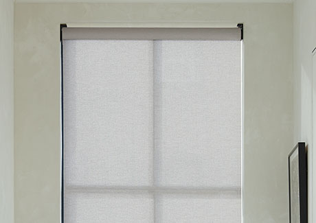 A close-up of solar shades for windows, in this case one installed by an inside mount in the inside of the window frame