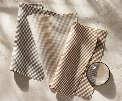 Swatches of Galley Gingham from the Studio McGee window treatments collection shows a delicate pattern