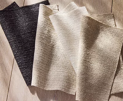Swatches of Gypsum Stripe from the Studio McGee window treatments collection shows a shimmering textured fabric