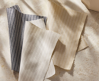 Swatches of Ticking Stripe from the Studio McGee window treatments collection shows a subtle striped pattern