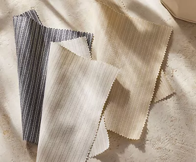 Swatches of Ticking Stripe from the Studio McGee window treatments collection shows a subtle striped pattern