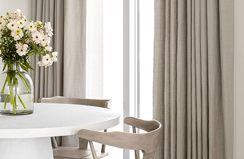 Home office curtains made of Luxe Linen in Silver feature blackout lining for a room darkening effect in a modern room