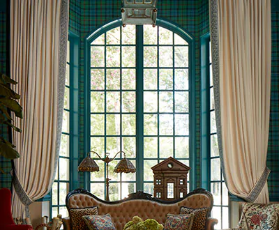 An elegant room features tall full arch head windows with elegant curtains for arched windows made of Baldwin in Pearl