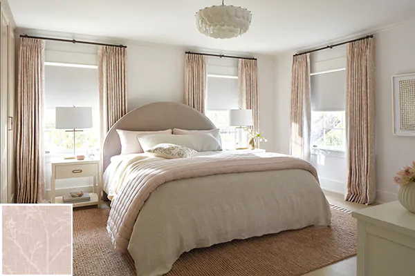 Colorful curtains made of Chinoiserie in Blush add an inviting warm hue to a bedroom with match bedspread