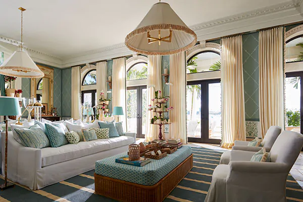 A luxurious large living room features curtains for arched windows made of Tailored Pleat Drapery in Luxe Linen, Oyster