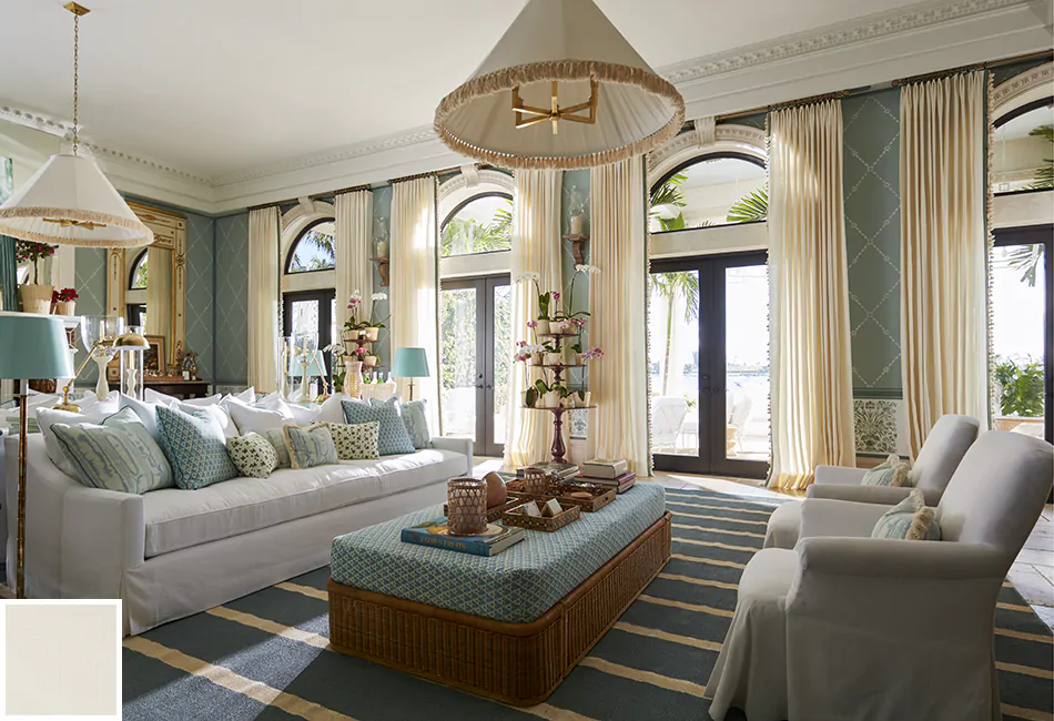 These floor-to-ceiling drapes along arched windows is a great way to get inspired with curtain ideas for living rooms
