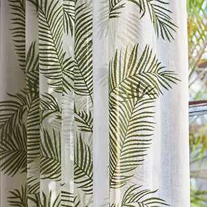 A close up of Martyn Lawrence Bullard's Palmier in Tropical shows the beautiful palm treen-inspired embroidered design
