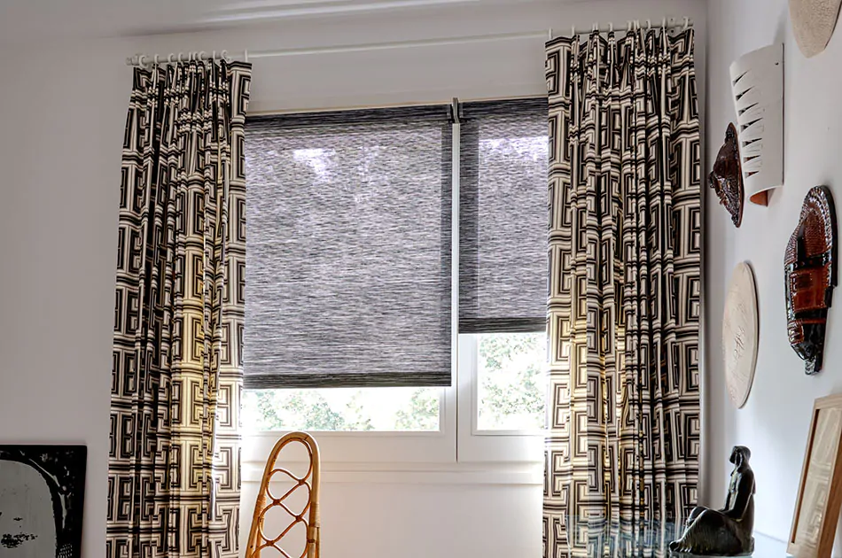 Man cave curtains made of Tailored Pleat Drapery in Peking Greek Key, Raven, adorn a modern office space