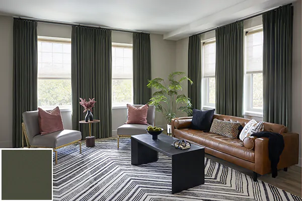 Colorful curtains made of Posh Velvet in Dark Green add a calming deep green to a modern living room with a chevron rug