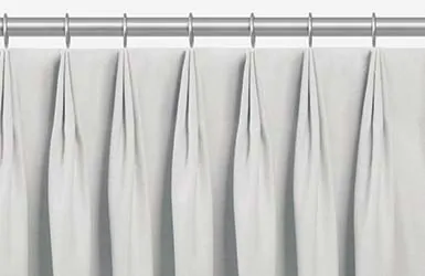 An example of drapery styles shown in a product image of tailored pleat drapery with three-fingered pleats pinched at the top
