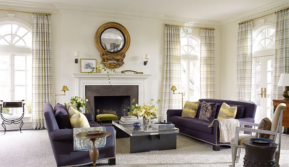 French door window treatments include Tailored Pleat Drapery made of Tidal Line in Slate on tall doors in a living room