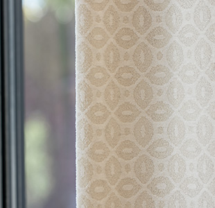 Tailored Pleat Drapery made of Petal in Pearl has blackout lining to block light and give the drapery a fuller body
