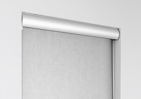 A close-up shot of a metal valance which is an optional customization to cover the tube of solar shades for windows