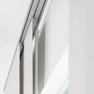 A close up of a baton control option for panel track blinds shows the thin metal baton behind the first panel
