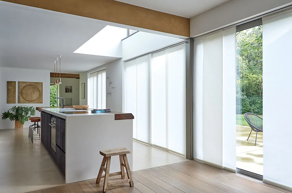 A mid-century modern kitchen shows the result of learning how to install vertical blinds of Park in Winter on a panel track