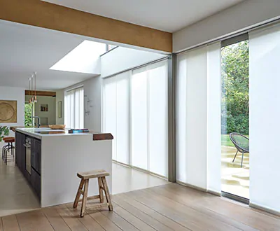 Vertical Blinds made of Park in White are a sleek, functional alternative to Scandinavian curtains on wide glass doors