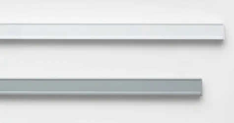 A product image of the two color options for vertical blinds track system shows a white track and a silver track