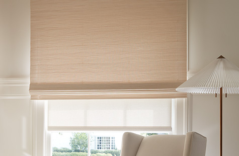 Bamboo blinds made of Somerset in Cloud offer a light color and texture to a window in a cream-colored playroom