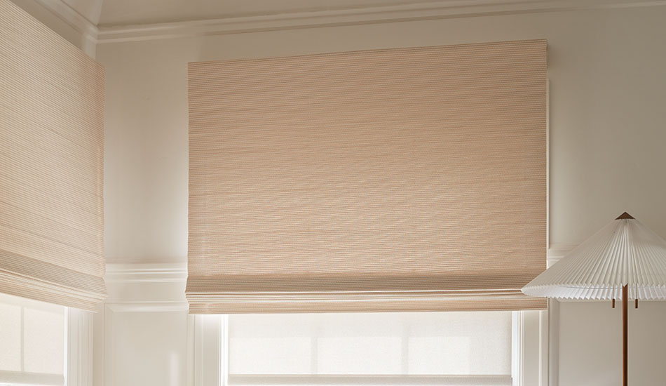 A Woven Wood Shade is layered over a Solar Shade, showing how to install shades that are layered in a window