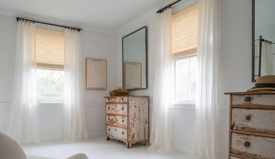 Window treatment trends 2023 include natural, sustainable materials like woven wood shades made of grasses and reeds