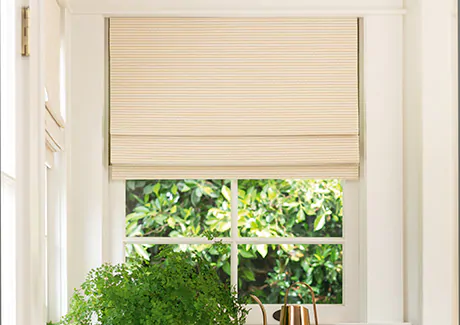 A close up of a Woven Wood Shade made of Somerset in Cloud shows the rustic texture ideal for farmhouse window treatments