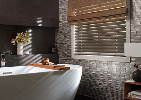 A bathroom shows the result of learning how to measure for blinds with Wood Blinds made of Bamboo in Coal in a small window