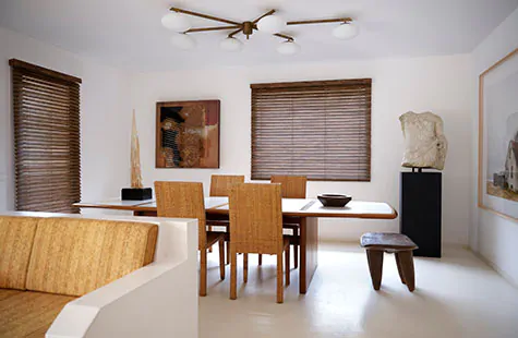 Outside mount blinds made of Exotic wood in Zebrano offer a rich wood tone to a mid century modern dining room