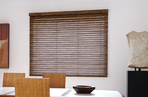 Wood Blinds made of 2-inch Exotic wood in Ebony adds a warm natural tone to a mid-century modern dining room