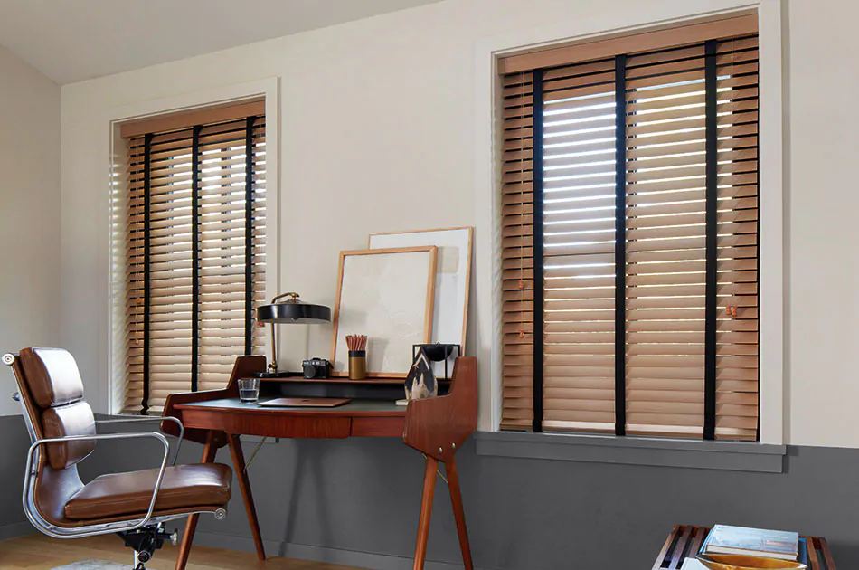 Inside mount blinds made of Exotic wood in Oak with black decorative tape offer a warm sophisticated aesthetic to an office