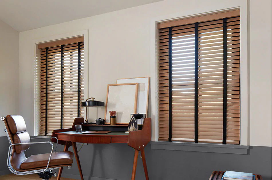 Inside mount blinds made of Exotic wood in Oak with black decorative tape offer a warm sophisticated aesthetic to an office