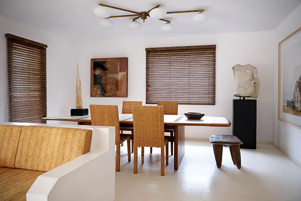 Wood Blinds made of 2-inch Exotic in Zebrano offer a warm wood tone and visual texture to a mid-century modern dining room