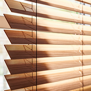 A close up of Wood Blinds made of 2-inch Exotic in Zebrano shows the varied grain pattern and warm wood tone of the slats