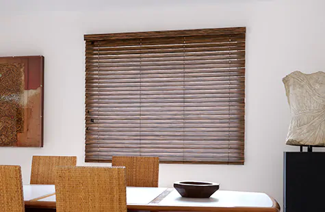 Wood Blinds made of 2-inch Exotic wood in Zebrano adds a warm natural tone to a mid-century modern dining room